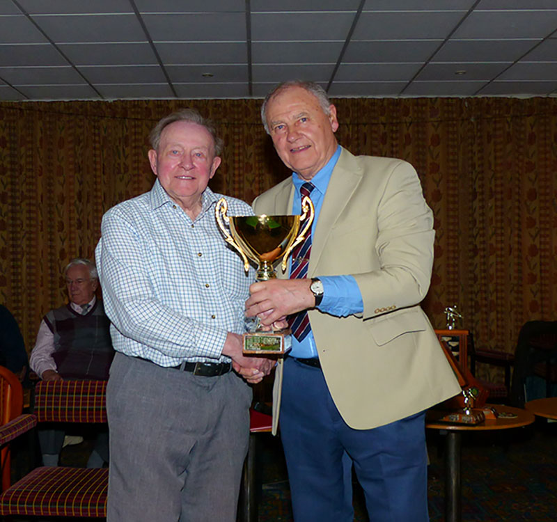 Dennis Wilkinson takes the KO Cup Trophy on behalf of the Elite 